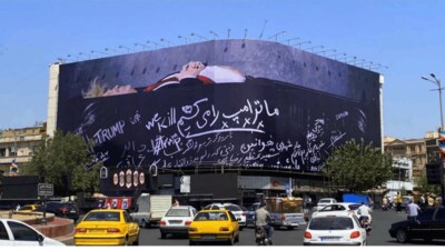 Iran's Giant Billboard Shows US President In Open Black Coffin With A ...