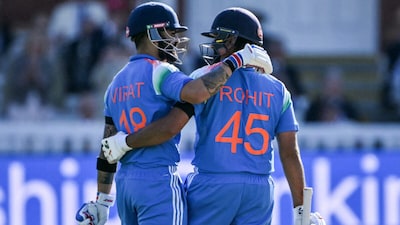 Virat Kohli (left) congratulates Rohit Sharma on hitting century at Lord's. (AFP Photo)