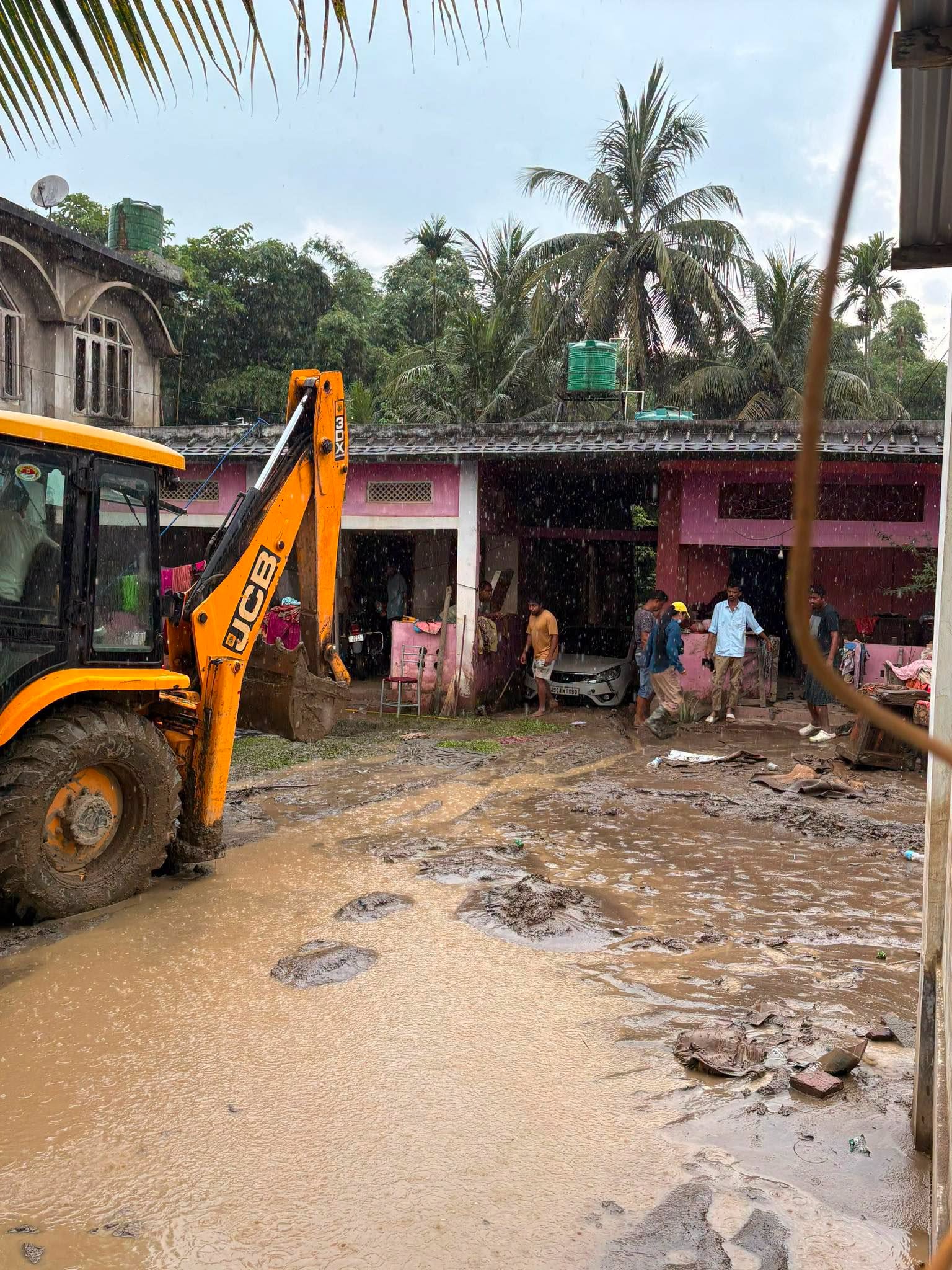 A Mission That Touched Hearts: One widow wished to perform her husband's last rites inside their mud-covered home. After locating her, Dolly cleared the buried house with her excavator, allowing the grieving family to bid farewell with dignity. A Mission That Touched Hearts: One widow wished to perform her husband's last rites inside their mud-covered home. After locating her, Dolly cleared the buried house with her excavator, allowing the grieving family to bid farewell with dignity.