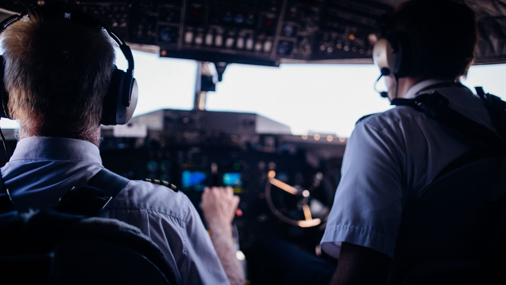 Commercial Pilots and Flight Engineers: While autopilot handles routine flight tasks, human pilots navigate dynamic weather emergencies, mechanical failures, and complex human coordination. Ultimate moral accountability and crisis management for hundreds of passengers rest entirely on human instincts. (Image: Pexels)