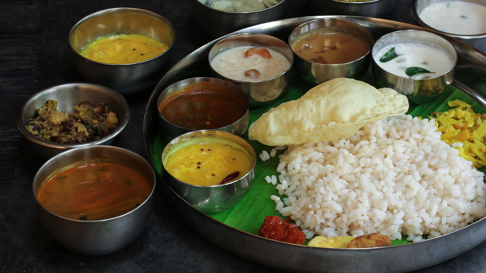 Rice, Dal And The Final CourseAt the centre of the meal is usually Kerala matta rice, the distinctive reddish-brown parboiled rice variety popular in the state. It is eaten with different combinations of curries, beginning with preparations such as parippu and ghee and moving through sambar and rasam. But the meal doesn't end there. Curd or buttermilk provides a cooling finish before the much-awaited dessert course.
