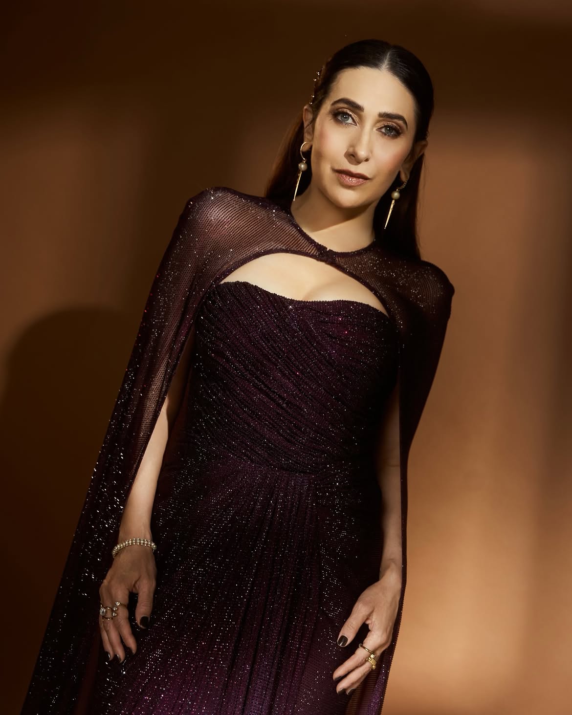 Karisma Kapoor Shows How To Ace Evening Glamour In A Sparkling Plum Cape Gown 7 Karisma 2026 08 c4ae892756b1c1d9133dd22b29c4ff84