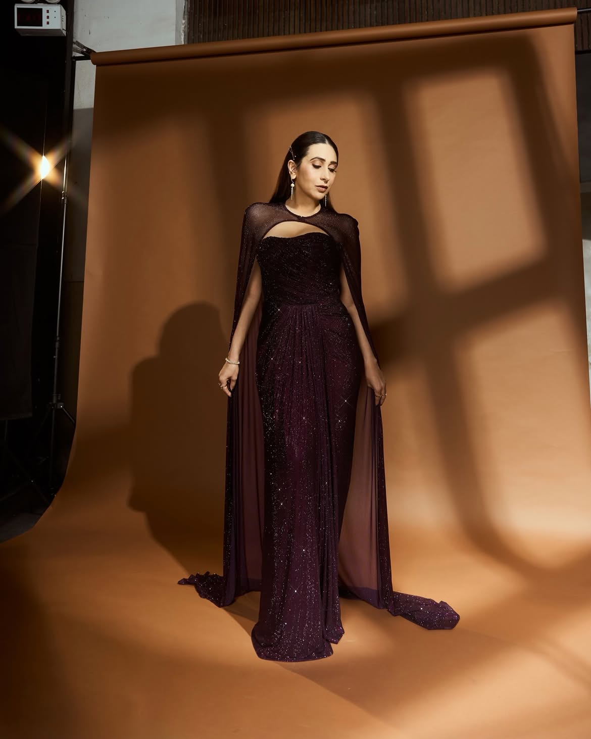 Karisma Kapoor Shows How To Ace Evening Glamour In A Sparkling Plum Cape Gown 6 Karisma 2 2026 08 744c4375d1dda65341668bc4b5207de8