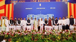 Karnataka Chief Minister DK Shivakumar and Governor Thawar Chand Gehlot pose with newly inducted ministers and other leaders after the swearing-in ceremony following the expansion of the state Cabinet, at Lok Bhavan, in Bengaluru.
