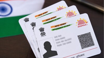 The Bombay High Court has called for coordinated action to trace and deport foreign nationals with fake or fraudulently obtained Aadhaar cards. (AI-generated image/News18)