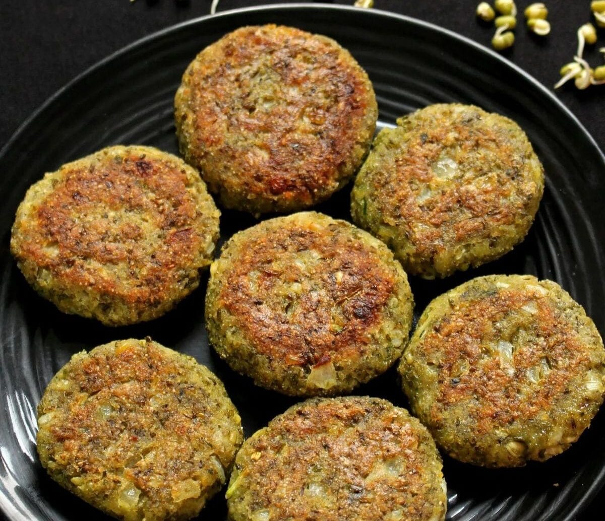 Now, add lemon juice and fresh chopped coriander and mix everything well. Divide the mixture into equal pieces and shape them into form, flattened cutlets.
