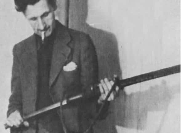 According to Orwell, destruction of history does not always look like burning books, sometimes it looks like rewriting them quietly, hidden beneath the illusion of progress and order. (Image: George_orwell_._)