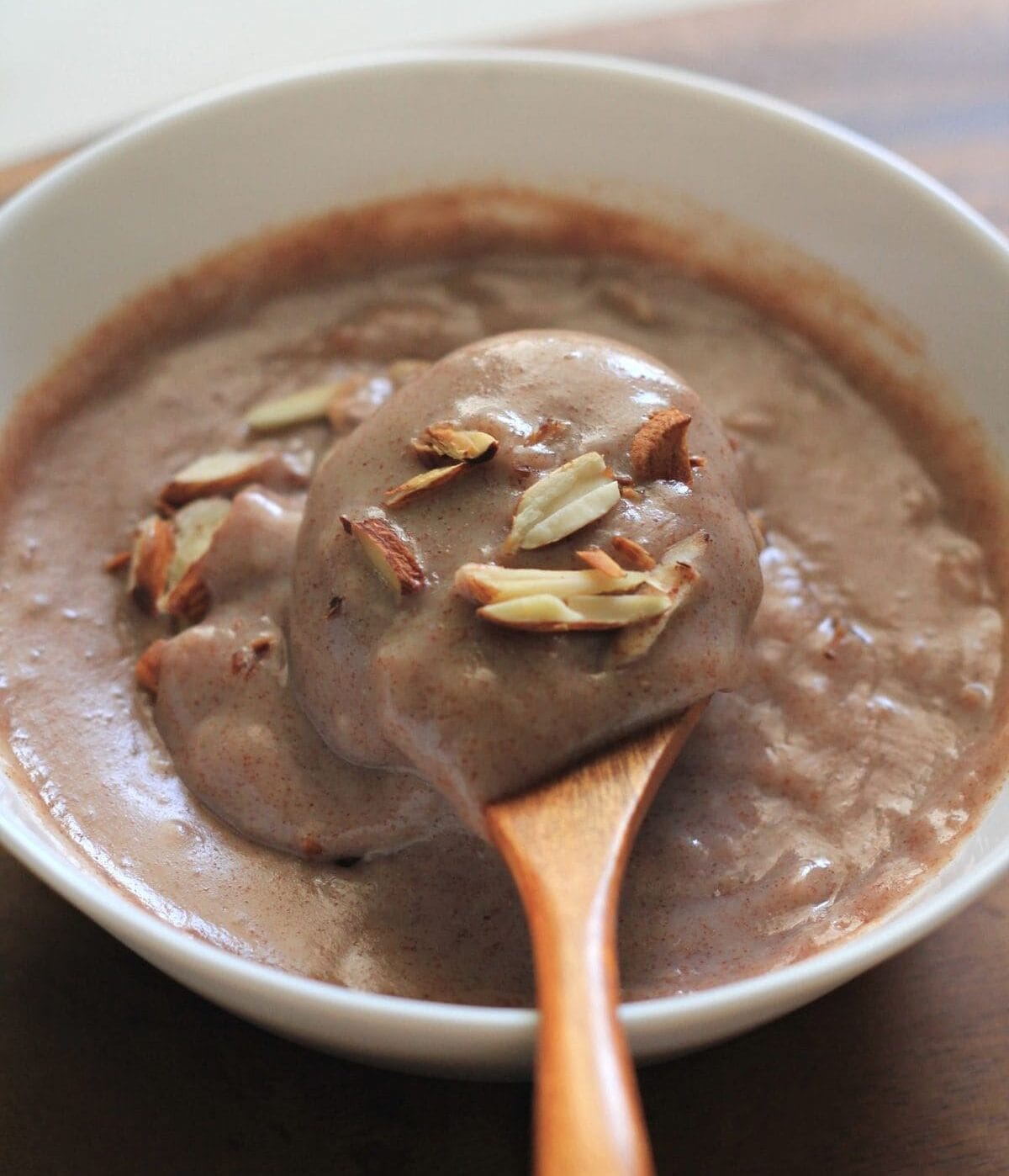 Place a pan on the stove and heat the ghee. When it melts, add the ragi flour and stir the flour slowly so it mixes well with the ghee. Keep stirring so the flour roasts evenly. 