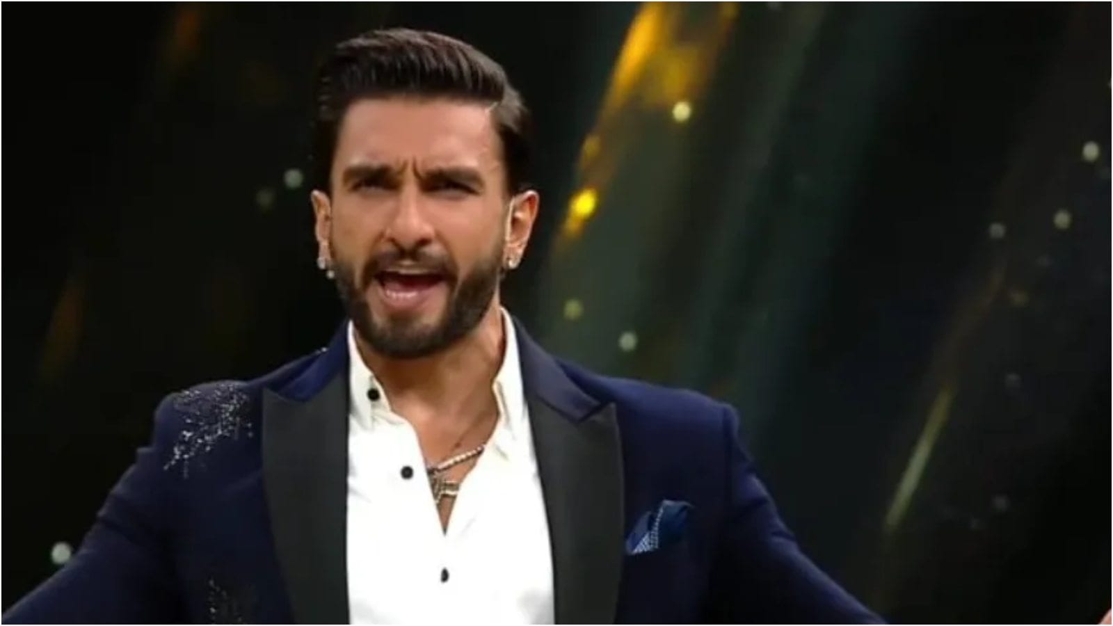 Ranveer Singh made his television debut in 2021 as the host of Colors TV’s visual-based quiz show The Big Picture. The game show tested contestants on their knowledge and visual memory, with Ranveer bringing his high-energy personality to the hosting role. The show premiered in October 2021 and ran for one season, marking the actor’s first major stint on television. Ranveer Singh made his television debut in 2021 as the host of Colors TV’s visual-based quiz show The Big Picture. The game show tested contestants on their knowledge and visual memory, with Ranveer bringing his high-energy personality to the hosting role. The show premiered in October 2021 and ran for one season, marking the actor’s first major stint on television.