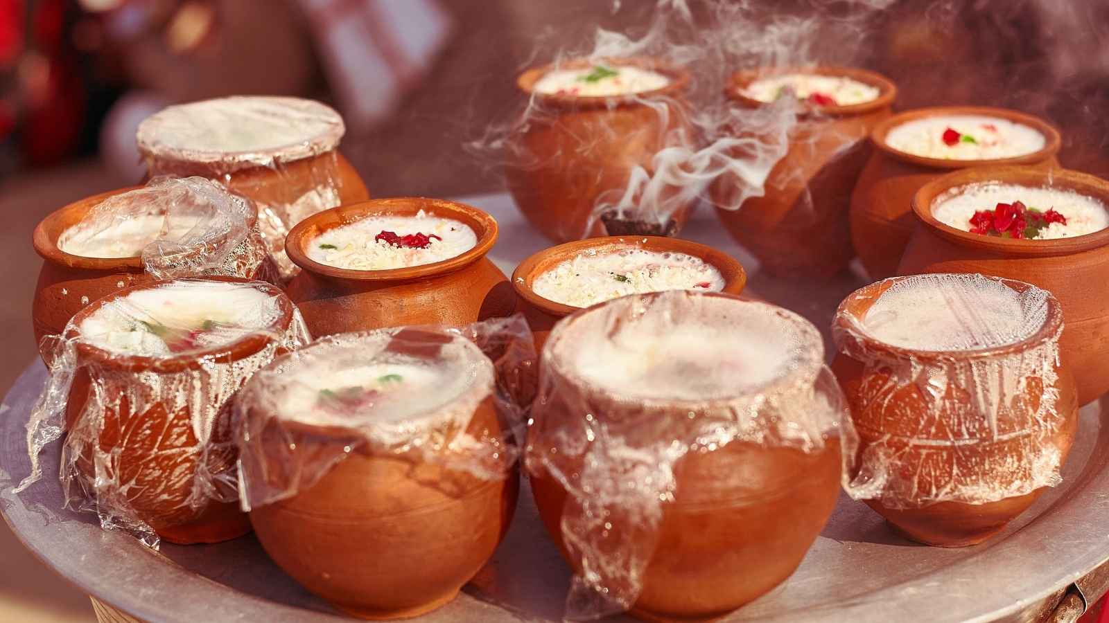 An earthenware pot can naturally help make homemade yogurt thicker. Its porous surface absorbs some excess moisture while the yogurt sets. It can also add a distinctive traditional flavor, making the yogurt especially enjoyable.