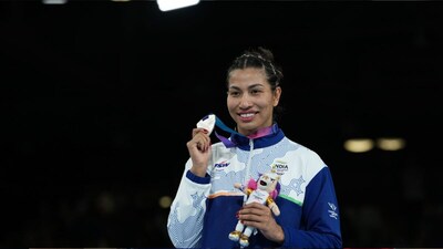 Lovlina Borgohain, silver medalist, poses for photos during the medal ceremony for women's 75kg boxing at the Commonwealth Games in Glasgow (Picture credit: AP)