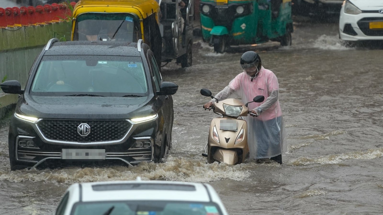 Heavy rain pounded Delhi-NCR through the day on Friday, leaving roads submerged and normal life severely disrupted across the region. (Image: PTI) Heavy rain pounded Delhi-NCR through the day on Friday, leaving roads submerged and normal life severely disrupted across the region. (Image: PTI)