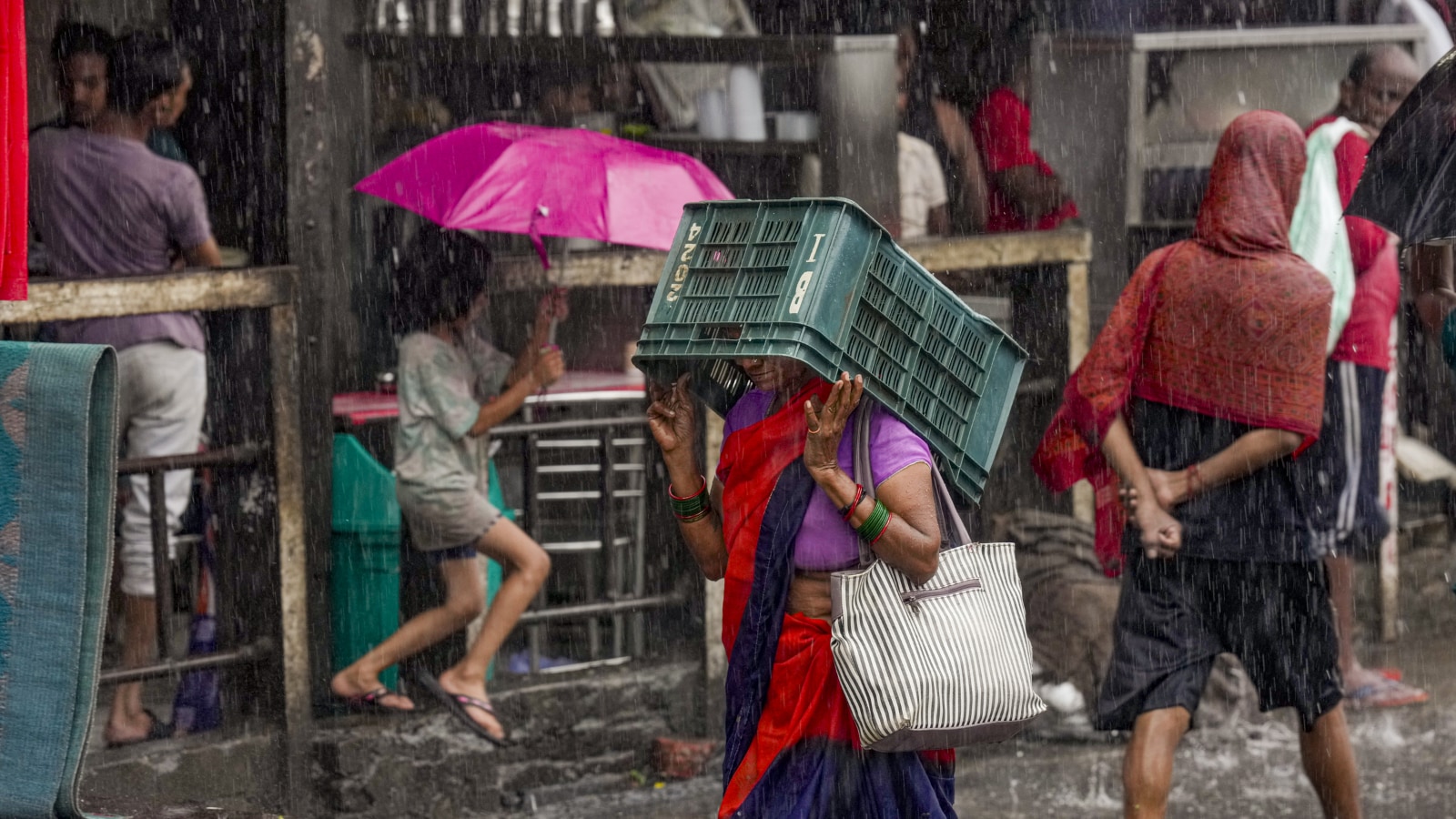 Dark clouds and incessant rainfall transformed several parts of Delhi into waterlogged zones, with low-lying areas bearing the brunt. (Image; PTI) Dark clouds and incessant rainfall transformed several parts of Delhi into waterlogged zones, with low-lying areas bearing the brunt. (Image; PTI)