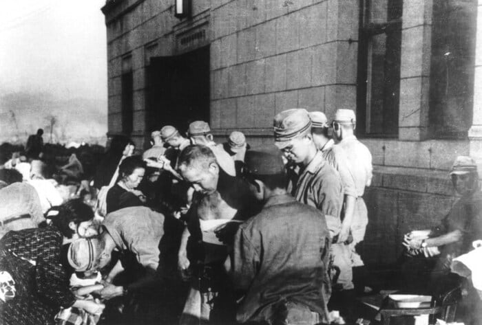 Survivors receive emergency medical treatment after the atomic bomb was dropped on Hiroshima. Thousands suffered severe burns and radiation-related injuries following the attack. (Image: AP file)