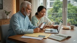 Elderly Indian pensioners checking Life Certificate status online.