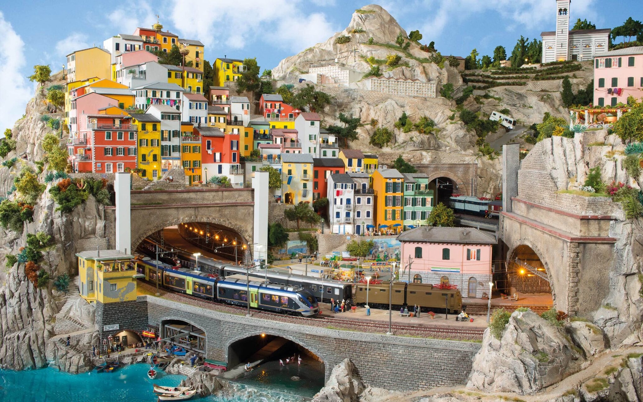 Miniatur Wunderland even has engineering marvels hidden beneath its miniature scenery. The Wendelberg contains the attraction's largest track helix, with 170 metres of railway tracks built inside the mountain. Twelve loops help trains climb around 1.4 metres before emerging near the summit.