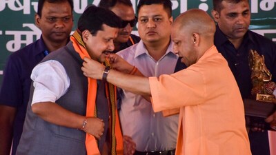 Uttar Pradesh Chief Minister Yogi Adityanath felicitates BJP National President Nitin Nabin in Meerut on Monday. (PTI)