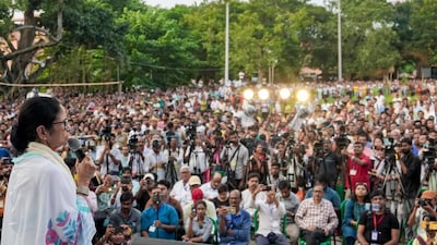 TMC supremo Mamata Banerjee addresses a public rally, at Serampore Court Maidan, in Hooghly district, West Bengal, on Saturday. Image/PTI