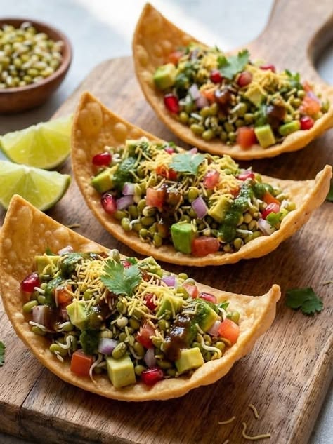 Avocado Sprout Chaat: Steamed sprouted moong beans and diced avocados are tossed with chaat masala, lemon juice, tomatoes, and fresh coriander. It provides a clean, protein-packed snack bursting with authentic Indian street-food tang without any fried elements or heavy carbs.