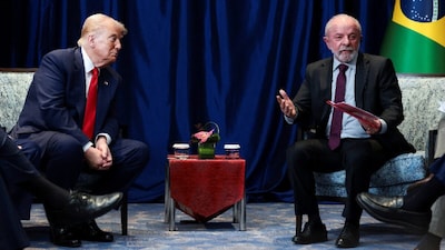 Trump listens to Brazilian President Luiz Inacio Lula da Silva speak as they meet on the sidelines of the 47th Association of Southeast Asian Nations (ASEAN) summit in Kuala Lumpur, Malaysia. (IMAGE: REUTERS FILE)
