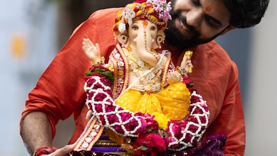 Visarjan is often an emotional moment: devotees thank Bappa for his presence and pray for his return. (Image: Canva)