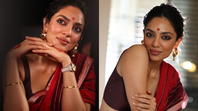 Sobhita Dhulipala channels Tamil tradition in a rich red khadi saree, gold jewellery and kolam-inspired hand art.