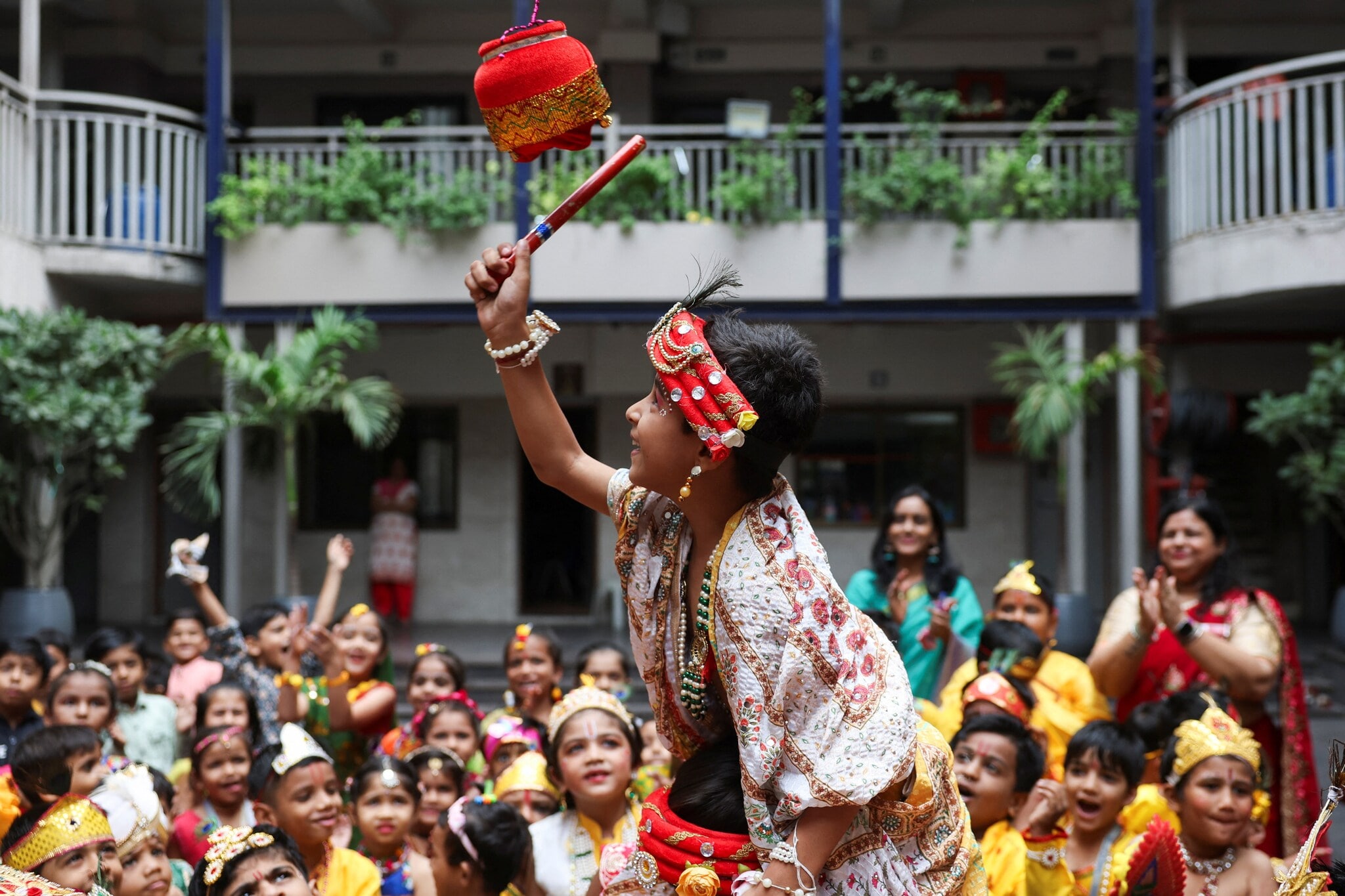 School students celebrates ‘dahi handi’ traditions at Ahmedabad, Gujarat. (Image: Reuters) School students celebrates ‘dahi handi’ traditions at Ahmedabad, Gujarat. (Image: Reuters)