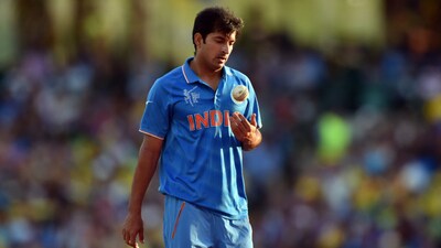 India's Mohit Sharma walks towards his mark to bowl against Australia during the Cricket World Cup semi-final at Sydney Cricket Ground on March 26, 2015.(AFP)