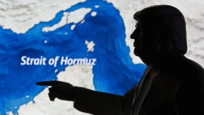 A map showing the Strait of Hormuz and a miniature model of US President Donald Trump. (IMAGE: REUTERS)