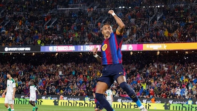Raphinha celebrates scoring his team's second goal during the Spanish league football match between FC Barcelona and Racing Santander (Picture credit: AFP)