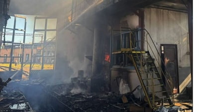Rescuers battle a fire at a warehouse damaged in an air strike in Brovary, Kyiv region, on September 19, 2026.