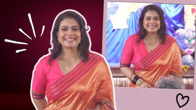 Kajol kicks off Mukherjee Bari Pujo with a vibrant orange saree and a contrasting pink blouse as she celebrates Maha Shashthi. Here's a closer look at her festive wardrobe.