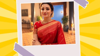Trisha Krishnan embraces old-school festive charm in a red saree with gold detailing, a richly embroidered blouse and traditional jewellery. Consider this your cue to go desi this Ashtami. 