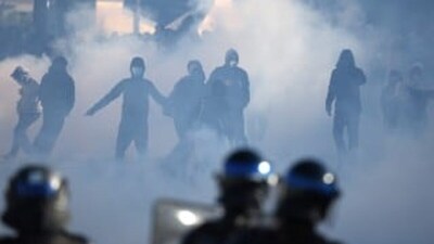 French police officers operate in the foreground as demonstrators stand amid tear gas during student protests near the Kerichen high school in Brest, western France. File pic/AFP
