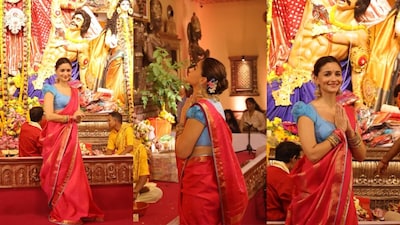Her saree appeared to be made of silk and had delicate gold zari motifs scattered across the body, and a broad gold zardozi-style finish framed the drape.