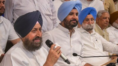 Congress leader Partap Singh Bajwa with fellow Punjab Congress leader Amrinder Singh Raja Warring (R) addresses a press conference at the party office, Chandigarh. (IMAGE: PTI FILE)
