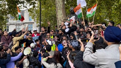 YouTuber Dhruv Rathee addresses demonstrators during a 'Stop Vote Chori' protest organized by the Indian Overseas Congress Youth Wing in London, Saturday, Oct. 17, 2026. (PTI Photo)