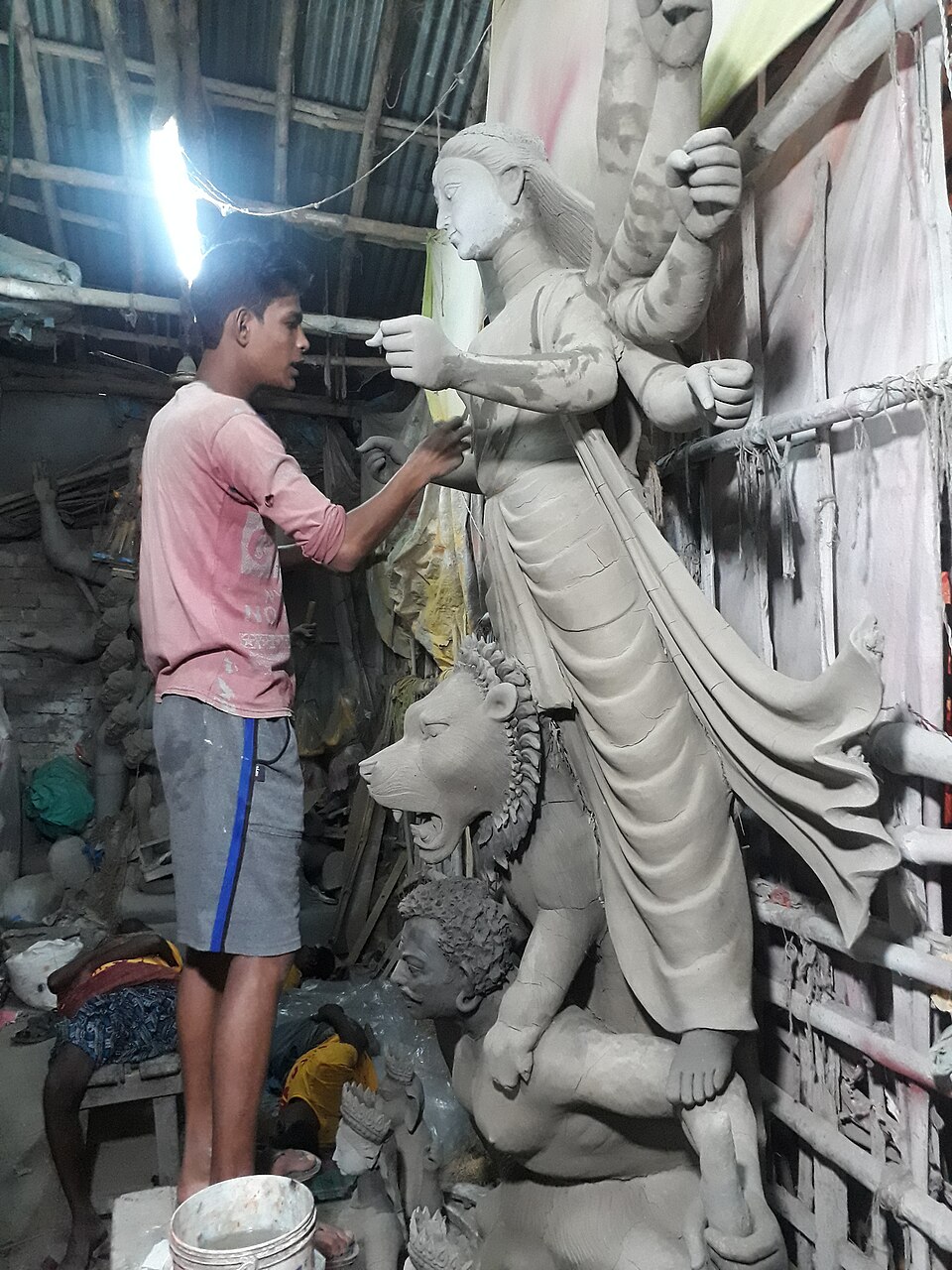 The term literally refers to “sacred earth”. Traditionally, a small amount of soil is collected from outside the home or premises of a sex worker and mixed with the clay used to make the idol. While the practice may seem surprising, it carries layers of symbolism connected to ideas of purity, society and the inclusive nature of Goddess Durga.
