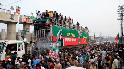 Supporters of former Pakistani Prime Minister Imran Khan's party, PTI, take part in a protest march lead by Sohail Afridi, CM of Khyber Pakhtunkhwa province, demanding Khan's release. (Image: Reuters)