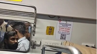 A passenger noticed the snake entering the panel above an upper berth. (Facebook)