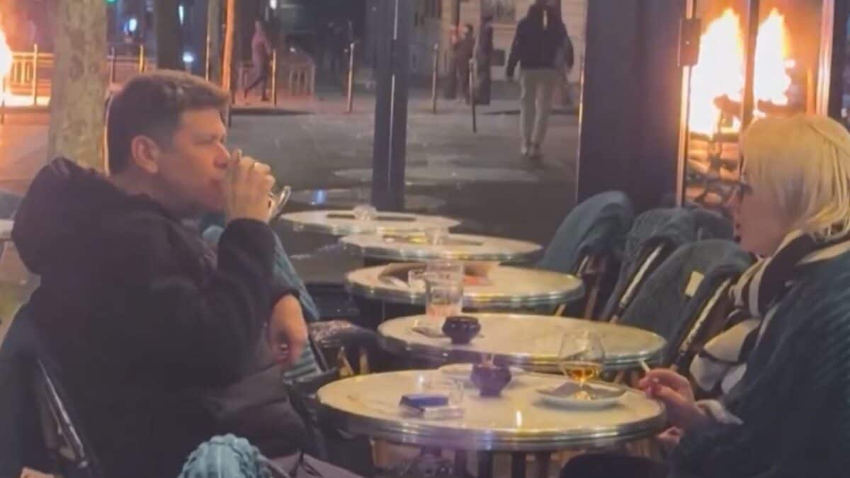 Checks Pattern Real World Unfazed By Flames, Couple Continues Cafe Date Amid France Protests ...