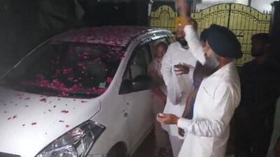 People shower flower petals on CBI cars in Chandigarh (Image credit: X/@mssirsa)
