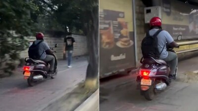 A video showing a man speeding along a Bengaluru footpath on a scooty, has triggered a debate online (Image-X/@sanatan_kannada)