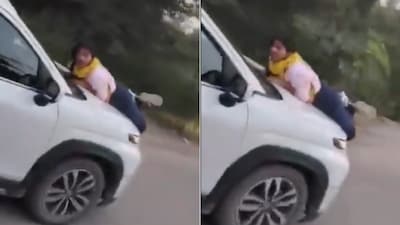 A woman in Meerut allegedly found herself clinging to the bonnet of a moving car after confronting her husband (Image-X/Sachingupta)
