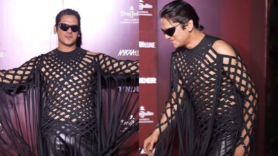 Vijay Varma wears a bold black cut-out top and oversized sunglasses at a Mumbai event.