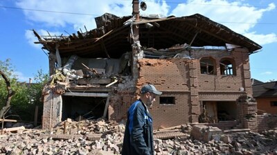 A man walks past a residential building heavily damaged in a Russian strike amid the ongoing Russia-Ukraine conflict. (Photo: AFP)