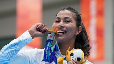 Gold medallist India's Lovlina Borgohain poses for photographers during the medal ceremony for the women's 75kg boxing event at the 20th Asian Games
