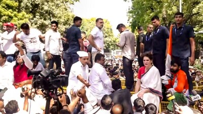 Leader of Opposition in the Lok Sabha Rahul Gandhi, Congress MP Priyanka Gandhi Vadra atop police security barricades after security forces stopped their dharna. (PTI)