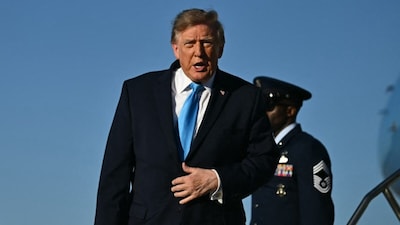 US President Donald Trump speaks as he steps off Air Force One upon arrival at Central Nebraska Regional Airport in Grand Island. (AFP PHOTO)