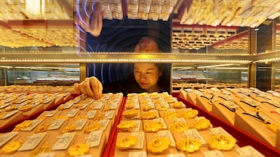 A falling price may make gold more attractive to a central bank seeking to increase its holdings, even when traders are selling. (AFP File Photo)